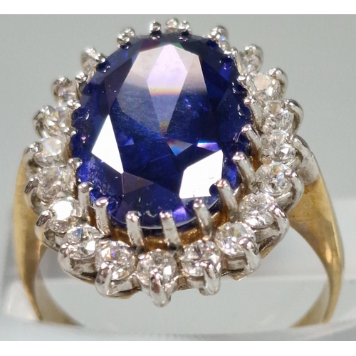 71A - 9ct gold Cubic Zirconia and blue oval stone dress ring. 5.6g approx. Size O1/2. (B.P. 21% + VAT)