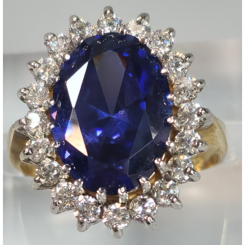 71A - 9ct gold Cubic Zirconia and blue oval stone dress ring. 5.6g approx. Size O1/2. (B.P. 21% + VAT)