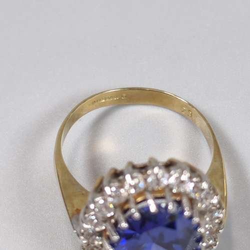 71A - 9ct gold Cubic Zirconia and blue oval stone dress ring. 5.6g approx. Size O1/2. (B.P. 21% + VAT)