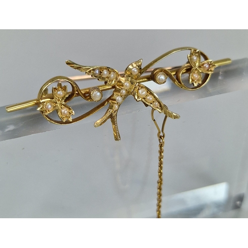 74 - Edwardian 15ct gold Swallow and floral bar brooch inset with a collection of seed pearls. 3.7g appro... 