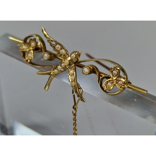 74 - Edwardian 15ct gold Swallow and floral bar brooch inset with a collection of seed pearls. 3.7g appro... 