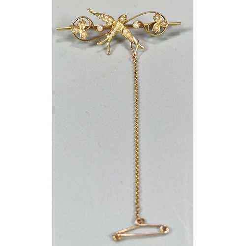 74 - Edwardian 15ct gold Swallow and floral bar brooch inset with a collection of seed pearls. 3.7g appro... 