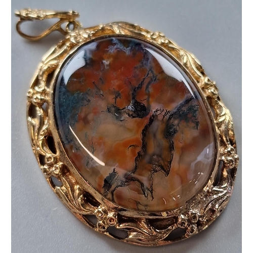 75 - 9ct gold ornate oval pendant inset with cabochon agate stone. Total weight 17.5g approx. 5.5x3.5cm a... 