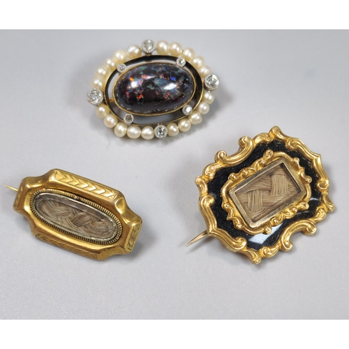 76 - Two gold Mourning brooches, one with inscription 'Mrs Elizal Davis, dated 1883', together with a gol... 