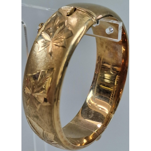 84A - 9ct gold engraved ladies bangle. 6.5cm diameter approx. 30g approx. (B.P. 21% + VAT)