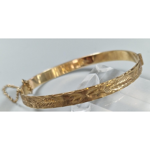 85 - 9ct gold engraved christening bangle. 6cm diameter approx. 11.5g approx.   (B.P. 21% + VAT)