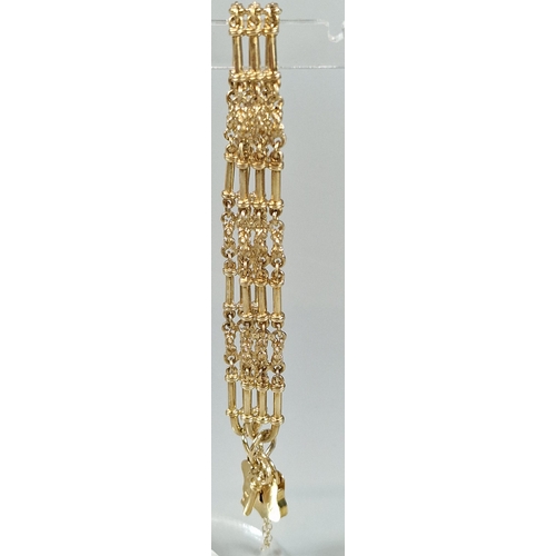 89A - 9ct gold three bar gate bracelet with shield padlock. 19g approx. (B.P. 21% + VAT)