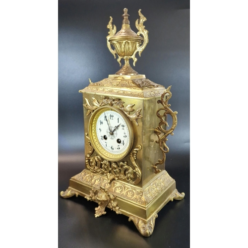 8A - Early 20th century French repoussé brass mantle clock, having urn finial over ceramic Arabic face, o... 