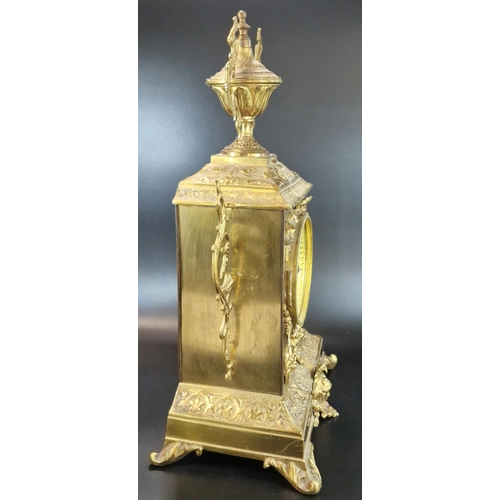 8A - Early 20th century French repoussé brass mantle clock, having urn finial over ceramic Arabic face, o... 