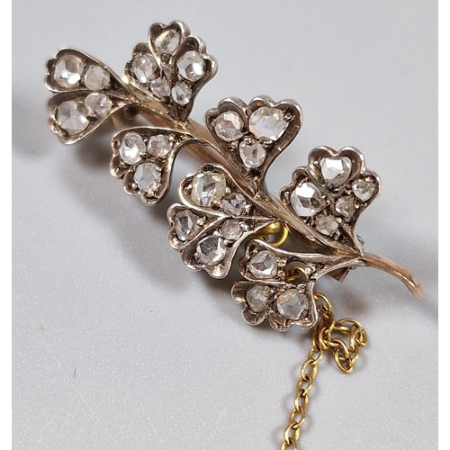 93 - Yellow metal flower spray brooch set with twenty eight diamonds (one missing). 3.4cm long approx. 2.... 