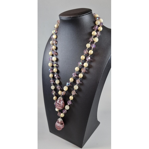 94 - Christian Dior beaded necklace with two pear shaped glass pendants. 100cm long approx. In lined box ... 