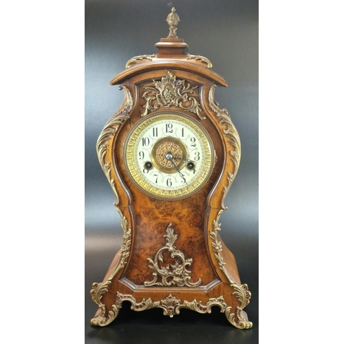 9A - 20th century French design mahogany balloon shaped boudoir clock, having gilt metal mounts to the ca... 