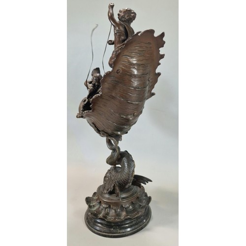 192 - After Emile Louis Picault, a late 19th century French Bronze centre piece of two winged cherubs with... 