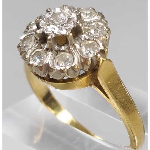 59 - 18ct gold diamond flowerhead cluster ring inset with nine diamonds. 6.5g approx. (B.P. 21% + VAT)