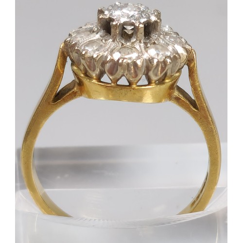 59 - 18ct gold diamond flowerhead cluster ring inset with nine diamonds. 6.5g approx. (B.P. 21% + VAT)