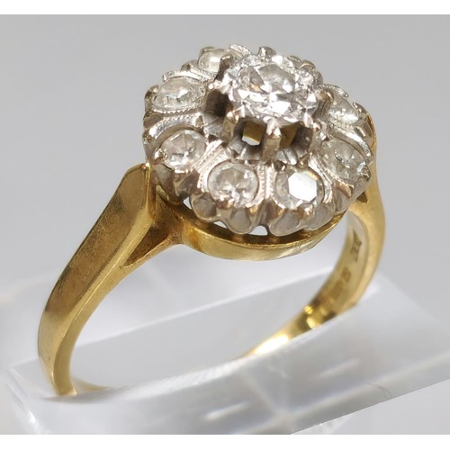 59 - 18ct gold diamond flowerhead cluster ring inset with nine diamonds. 6.5g approx. (B.P. 21% + VAT)