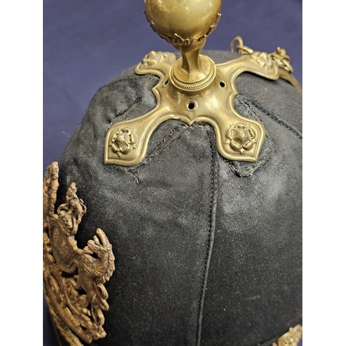 182 - British Royal Artillery blue cloth helmet, with the frontal plate of the Royal Arms pattern with can... 