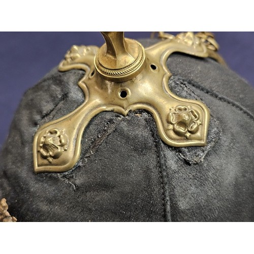 182 - British Royal Artillery blue cloth helmet, with the frontal plate of the Royal Arms pattern with can... 