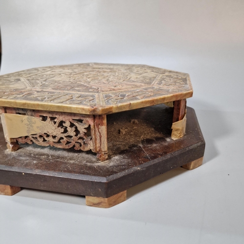 197 - Chinese carved and reticulated soap stone (steatite) stand, of octagonal form on a wooden base, the ... 