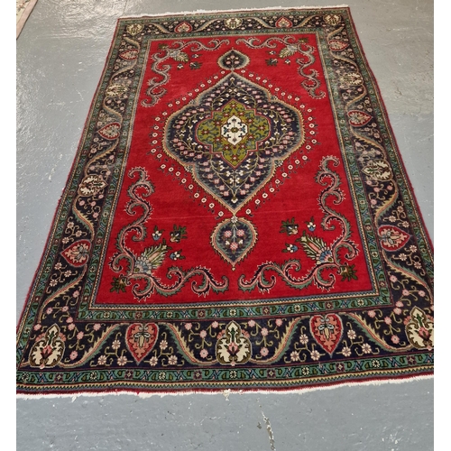 329 - Large hand woven traditional Oriental design woolen vintage carpet, having central floral and foliat... 