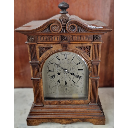 110 - Early 20th century German walnut architectural mantle clock with silvered Roman face. 37cm high appr... 