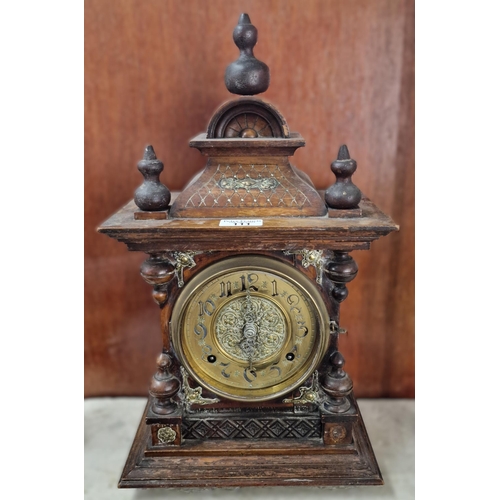 111 - Early 20th century German oak two train architectural mantle clock with Arabic face. 47cm high appro... 