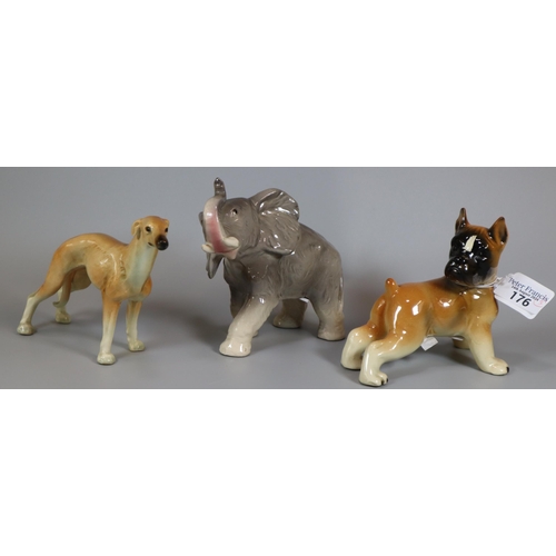 176 - Three German and West German ceramic animals to include: Elephant Calf, Boxer dog and a Lurcher/Grey... 