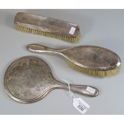 220 - Bag of silver topped vanity items to include: hand mirror and two brushes. (B.P. 21% + VAT)