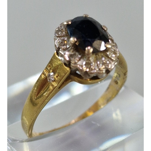 227 - 18ct gold diamond and sapphire cluster ring with tiny diamond chips to the shoulders. 4.5g approx. S... 