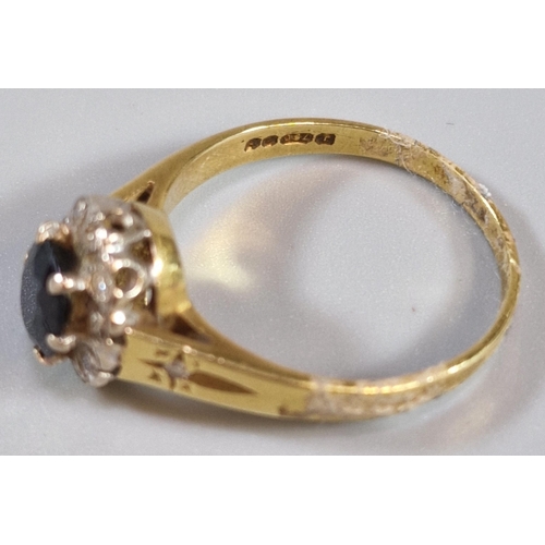 227 - 18ct gold diamond and sapphire cluster ring with tiny diamond chips to the shoulders. 4.5g approx. S... 