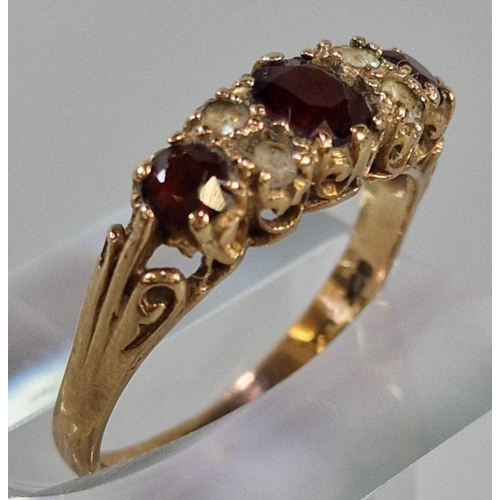 228 - 9ct gold garnet and clear stone ring. 2.1g approx. Size Q1/2. (B.P. 21% + VAT)