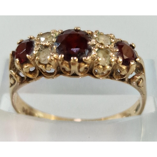 228 - 9ct gold garnet and clear stone ring. 2.1g approx. Size Q1/2. (B.P. 21% + VAT)