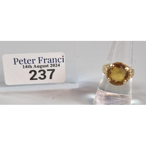 237 - Yellow metal and orange stone dress ring. 4.7g approx. Size N. (B.P. 21% + VAT)