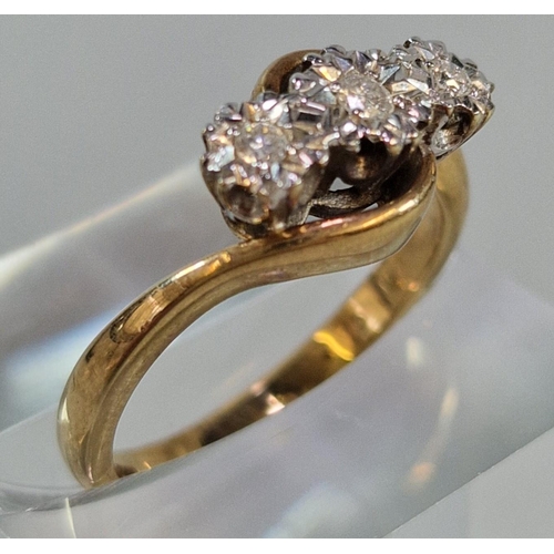 242 - 9ct gold three stone diamond twist shank ring. 3.8g approx. Size M1/2.  (B.P. 21% + VAT)