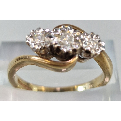 242 - 9ct gold three stone diamond twist shank ring. 3.8g approx. Size M1/2.  (B.P. 21% + VAT)