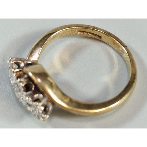 242 - 9ct gold three stone diamond twist shank ring. 3.8g approx. Size M1/2.  (B.P. 21% + VAT)