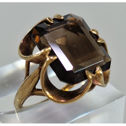 243 - 9ct gold smokey quartz ring. 4.8g approx. Size K.  (B.P. 21% + VAT)