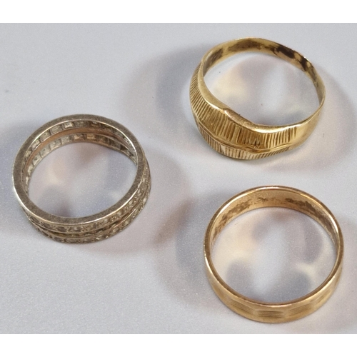 244 - 9ct gold eternity style ring together with two yellow metals rings. Total weight 9g approx. (3) (B.P... 