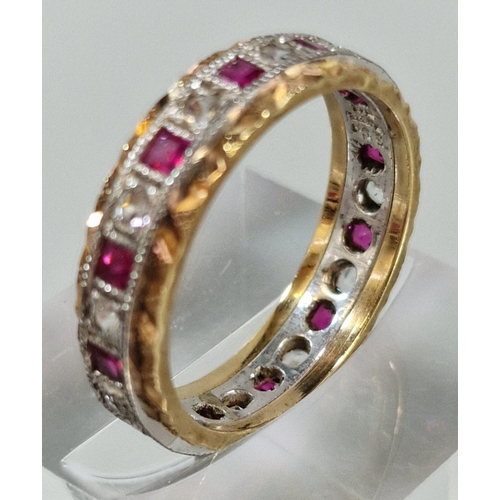 249 - 9ct gold ruby and clear stone eternity style ring. 3.9g approx. Size O. (B.P. 21% + VAT)