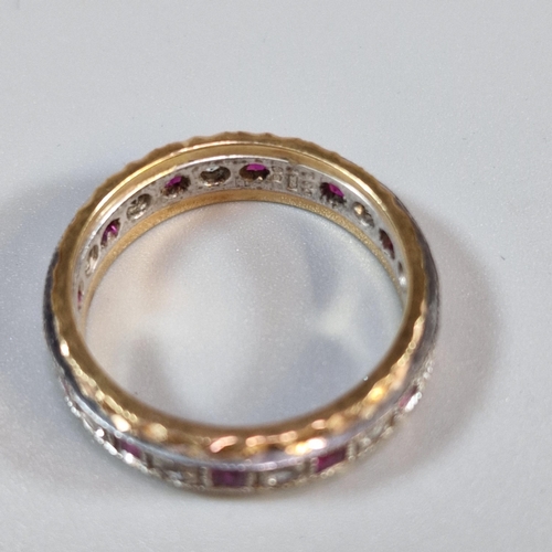 249 - 9ct gold ruby and clear stone eternity style ring. 3.9g approx. Size O. (B.P. 21% + VAT)