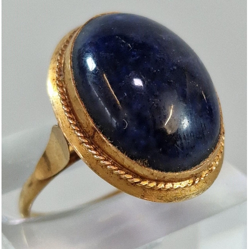 253 - Yellow metal and Lapis Lazuli cabochon stone dress ring. 4g approx. Size L. (B.P. 21% + VAT)