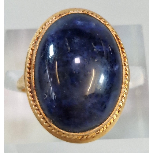 253 - Yellow metal and Lapis Lazuli cabochon stone dress ring. 4g approx. Size L. (B.P. 21% + VAT)