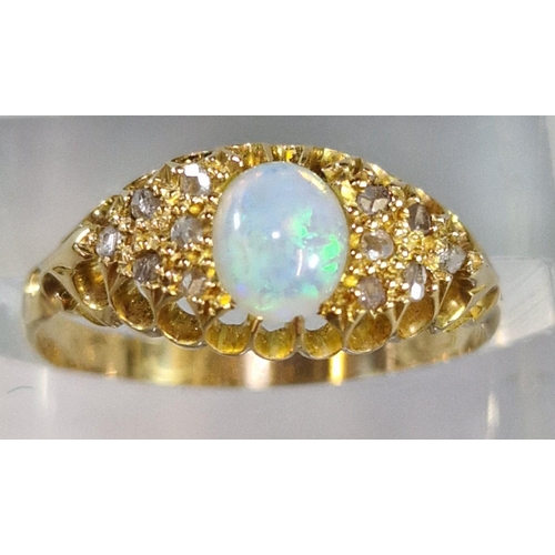 258 - 18ct gold opal cabochon ring inset with tiny diamond chips. 2.4g approx. Size P. (B.P. 21% + VAT)