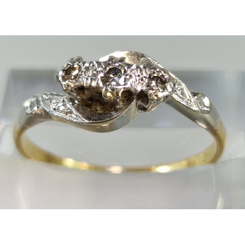 262 - 18ct gold and platinum three stone diamond twist shank ring. 2.6g approx. Size P. (B.P. 21% + VAT)