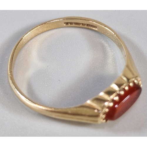 265 - 9ct gold and orange stone ring. 1.6g approx. Size P. (B.P. 21% + VAT)