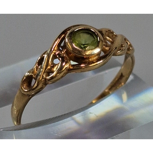 268 - 9ct gold Celtic design peridot ring. 1.4g approx. Size P. (B.P. 21% + VAT)