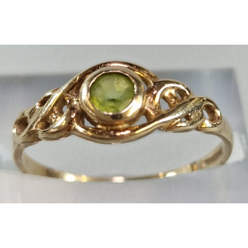 268 - 9ct gold Celtic design peridot ring. 1.4g approx. Size P. (B.P. 21% + VAT)