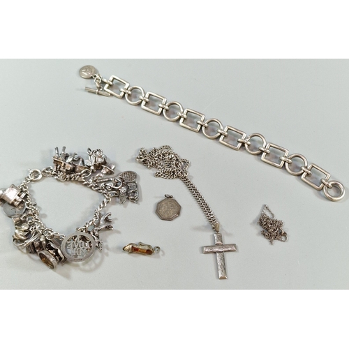 284 - Collection of silver to include: charm bracelets, loose charms, chain with crucifix cross etc. Total... 