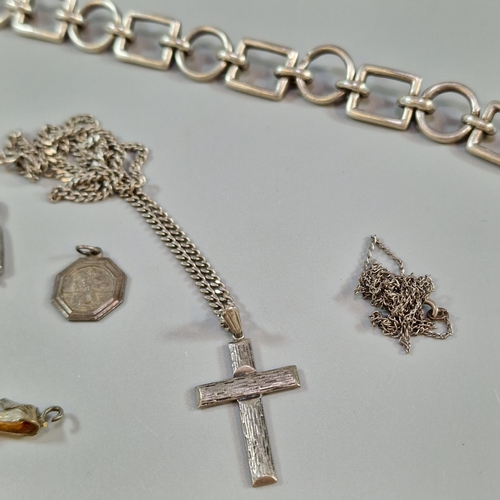 284 - Collection of silver to include: charm bracelets, loose charms, chain with crucifix cross etc. Total... 