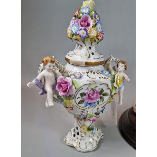 3 - Pair of German porcelain continental two handled vases and covers decorated with cherubs and encrust... 